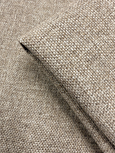 Close-up of Soho Cinnamon upholstery fabric by Super Cheap Fabrics, 150cm wide, showing its beige, coarse woven texture and natural color variations—ideal as a medium weight option for upholstery projects.
