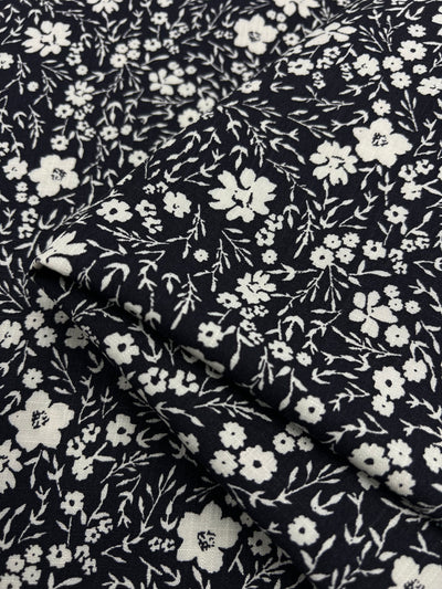Our High-quality printed linen fabric featuring stunning and intricate designs, perfect for creating your next garment creations and home decor items. This stunning print provides depth and a gorgeous floral design pergect for dresses, pants, light cardigans and home decor!