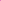 A close-up of Soft Tulle - Very Berry (150cm) by Super Cheap Fabrics, partially unrolled on a white surface. This sheer, lightweight, and slightly textured bright pink fabric is ideal for bridal veils or costumes.