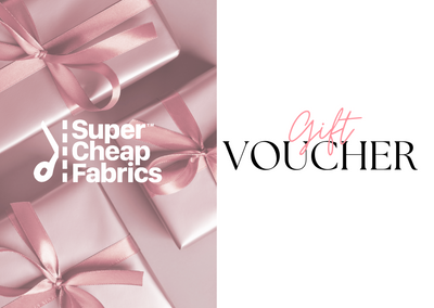 A Super Cheap Fabrics Gift Vouchers image split into two sections. The left side shows pink wrapped presents with pink ribbons and the text "Super Cheap Fabrics" overlaid in white. The right side has the words "Gift Voucher" in black, with "Gift" written in pink cursive, perfect for any sewing enthusiast to redeem online.