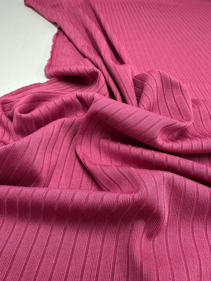 Ribbed Lilac Rose fabric by Super Cheap Fabrics, draped to reveal its texture and folds, showcases the beauty of medium-weight knit. Width: 170cm.