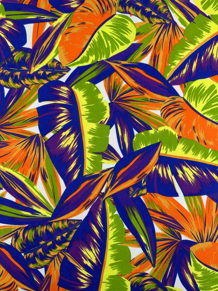 The Cotton Duck - Palm Nectarine - 140cm by Super Cheap Fabrics showcases an abstract tropical leaf pattern in vibrant orange, green, blue, and yellow on medium weight cotton. Ideal for home décor, it offers a dynamic mix of light and dark shades for an energetic feel.