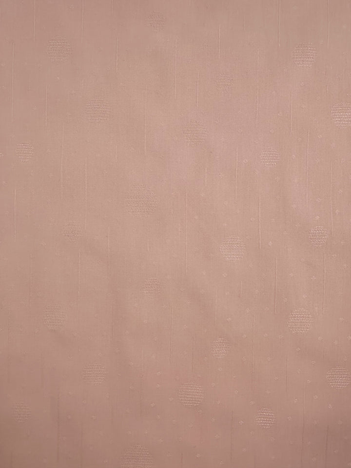 Close-up of Super Cheap Fabrics' Textured Cotton - Silver Pink, 143cm: an extra lightweight fabric of 100% cotton, featuring a smooth texture with subtle dots and faint vertical lines, creating a minimalist appearance in a soft, neutral color.