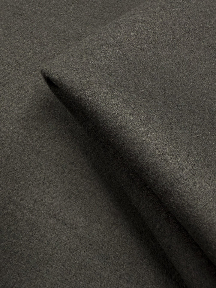A close-up of Super Cheap Fabrics’ Wool Cashmere in Agave Green (150cm), highlighting its soft texture and smooth, even weave.