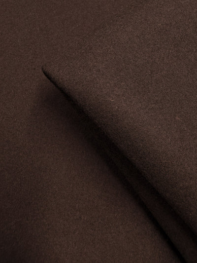 A close-up of folded Melton Wool - Black Coffee (150cm) by Super Cheap Fabrics highlights its soft, smooth texture and rich color—ideal for luxurious outerwear.
