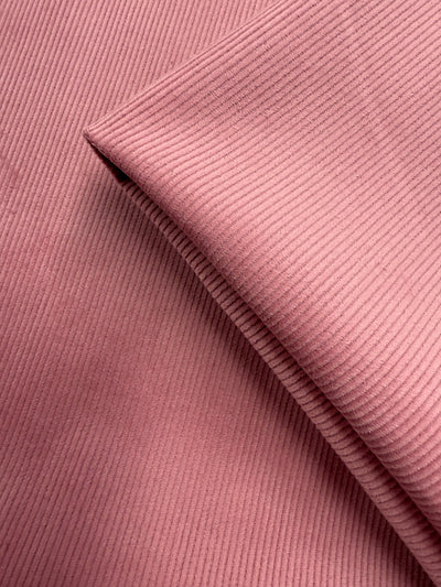 Close-up of Super Cheap Fabrics’ Pin Wale Corduroy in Blush (147cm), showing its soft ridged texture—ideal for cozy winter wear.