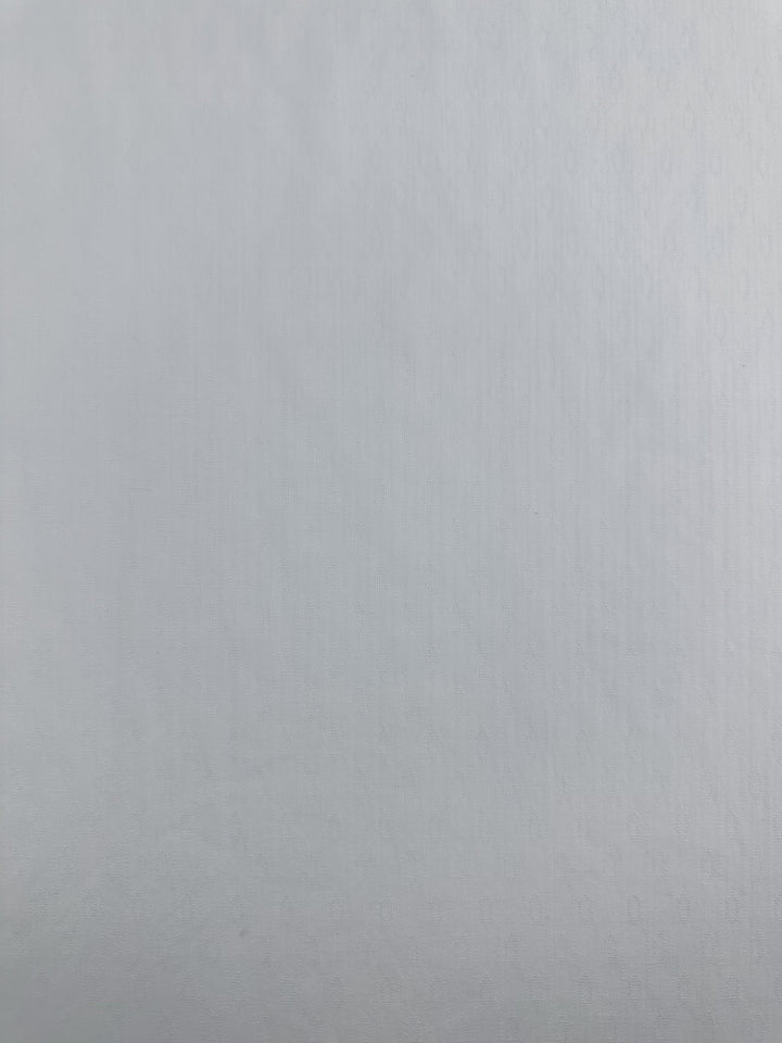 A close-up of "Textured Cotton - Ice Melt - 145cm" by Super Cheap Fabrics reveals a subtle, fabric-like texture reminiscent of lightweight cotton.