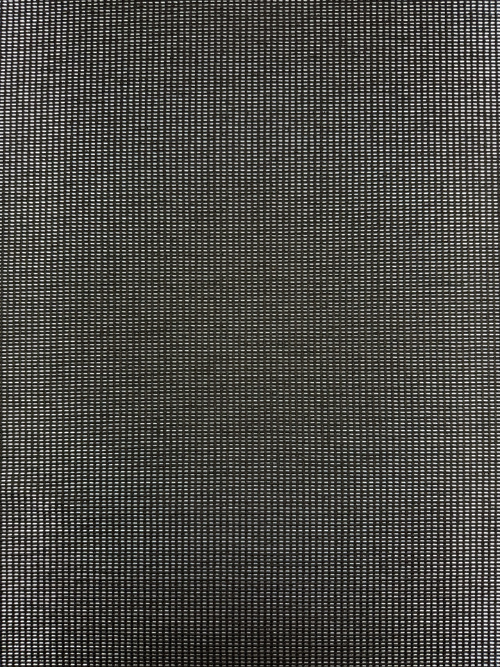 A close-up of Super Cheap Fabrics’ Linen Blend - Silver Dash (135cm) shows a textured surface with a regular grid of small, evenly spaced circular holes, resembling black mesh or perforated metal.