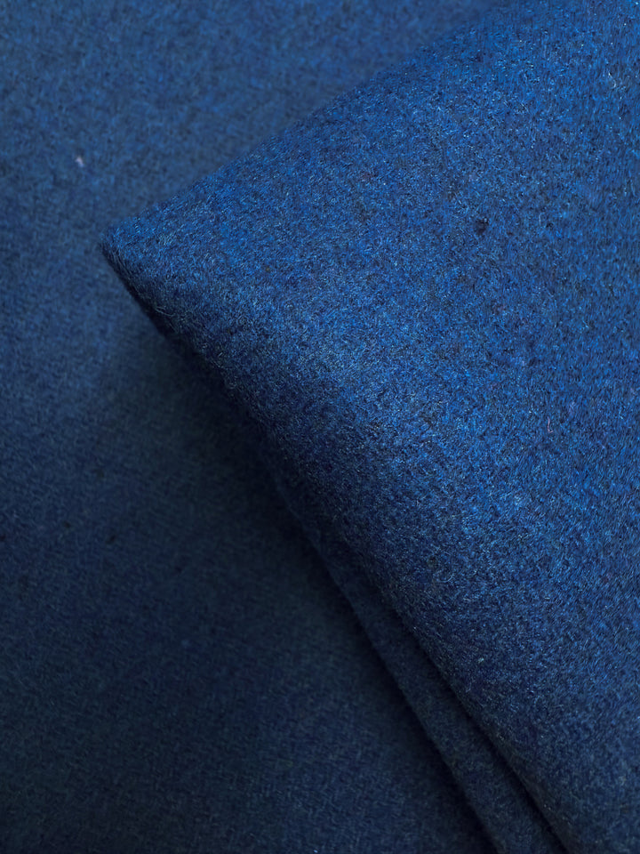A close-up of Super Cheap Fabrics' Melton Wool - Blue Quartz (150cm), showing its textured, soft, and slightly fuzzy surface—ideal as a heavyweight wool fabric for outerwear.