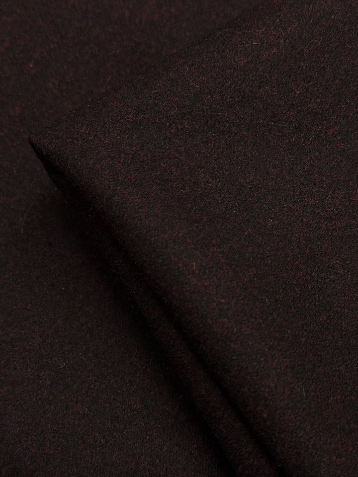 A close-up of Super Cheap Fabrics' Melton Wool - Valentine Marle (152cm), showcasing its dark brown, soft texture with subtle surface fibers—perfect for stylish outerwear.