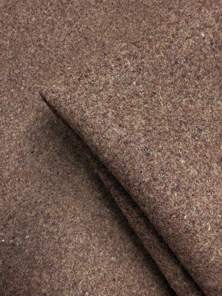 Close-up of Super Cheap Fabrics' Melton Wool in Cognac (150cm), highlighting its coarse, textured surface with visible flecks of light and dark fibers.
