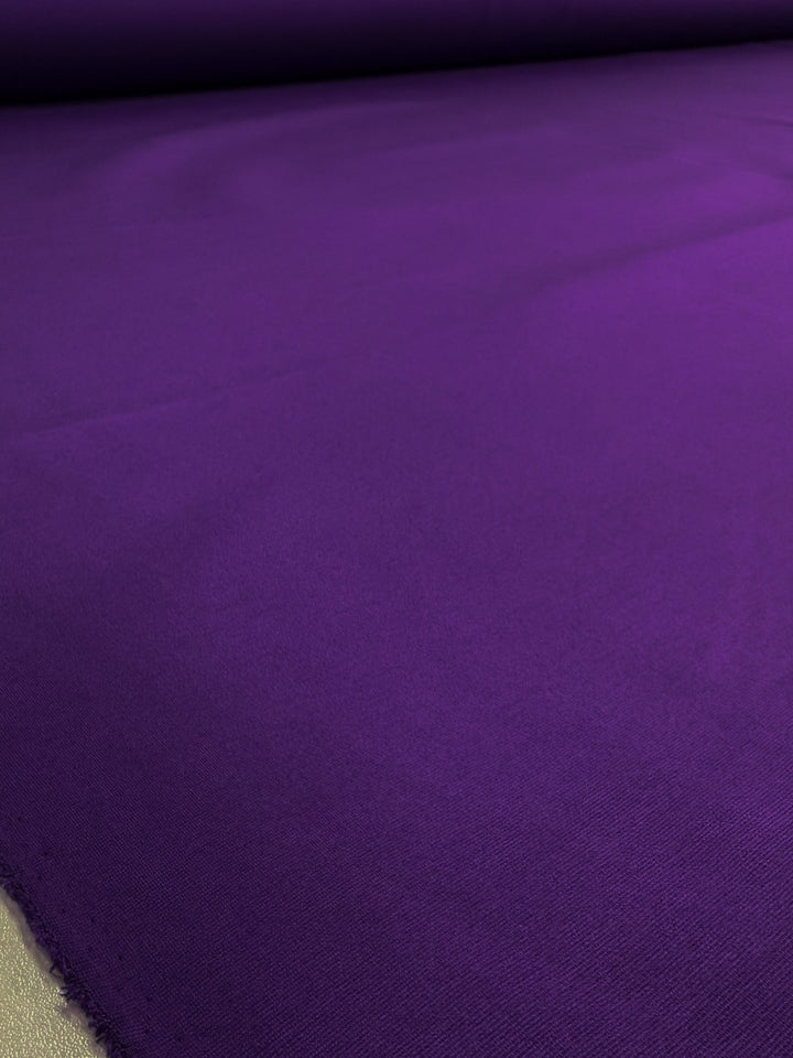 A close-up of Super Cheap Fabrics’ Milano Ponte in Violet Indigo (165cm), a vibrant, smooth heavyweight fabric with a soft texture—ideal for stretch suiting or fitted dresses.