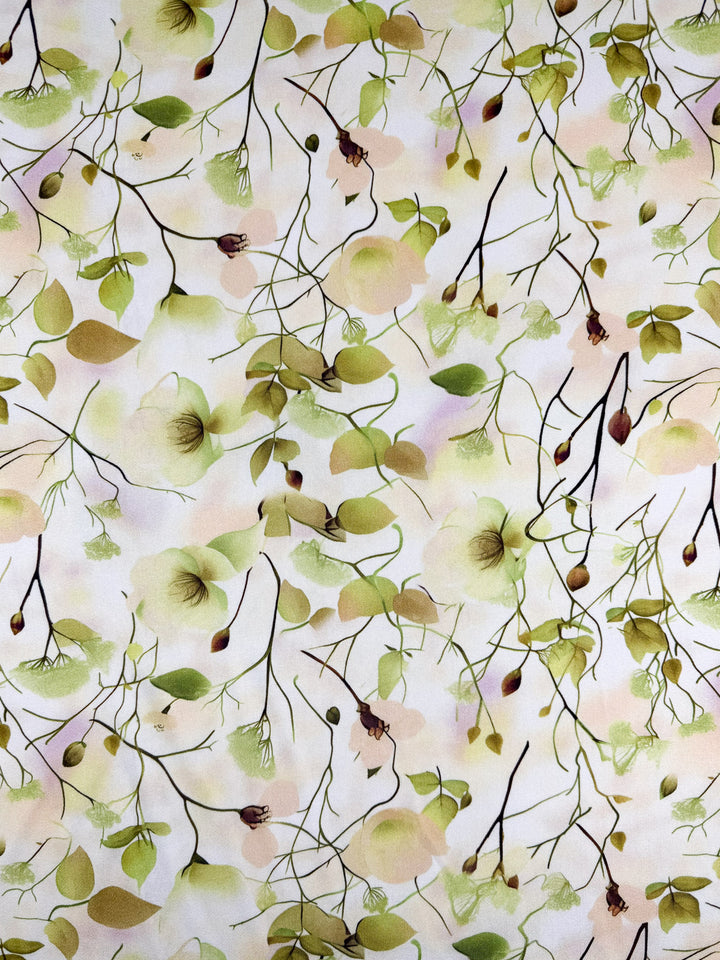 Sunlit Bouquet by Super Cheap Fabrics features a seamless botanical pattern of delicate branches, green leaves, and soft flowers on a pale background in mercerised rayon (150cm), evoking the light, airy feel of premium lightweight fabric.
