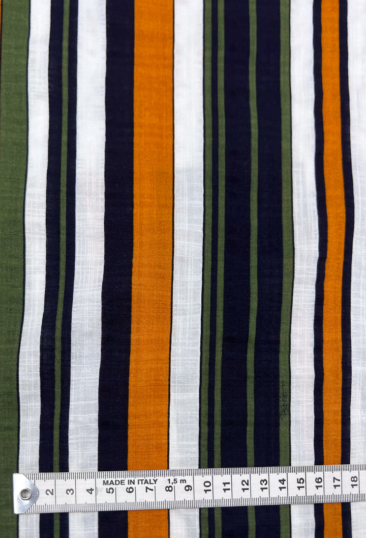 This fabric, named "Linen Blend - Retro - 145cm" by Super Cheap Fabrics, features vertical stripes in orange, navy, olive green, and white on breathable linen material, making it an ideal choice for summer ensembles. The measuring tape placed horizontally at the bottom displays a range from 3 to 17 centimeters.