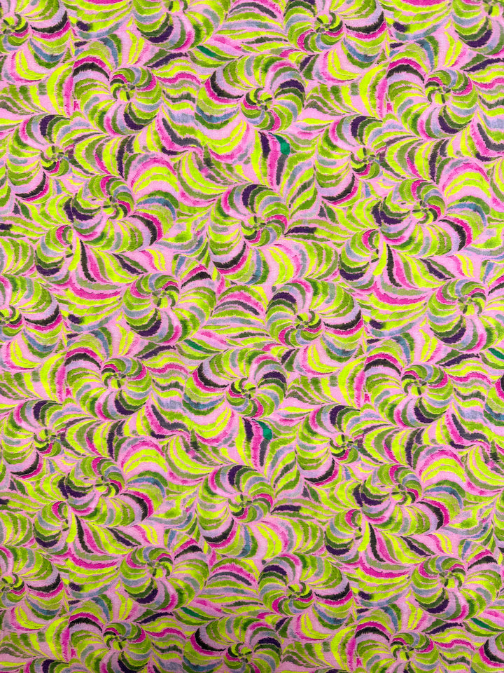 Neon Vortex by Super Cheap Fabrics features a vibrant, abstract swirl of green, yellow, pink, and purple on lightweight designer cotton (145cm wide)—a colorful, dynamic fabric ideal for standout projects.