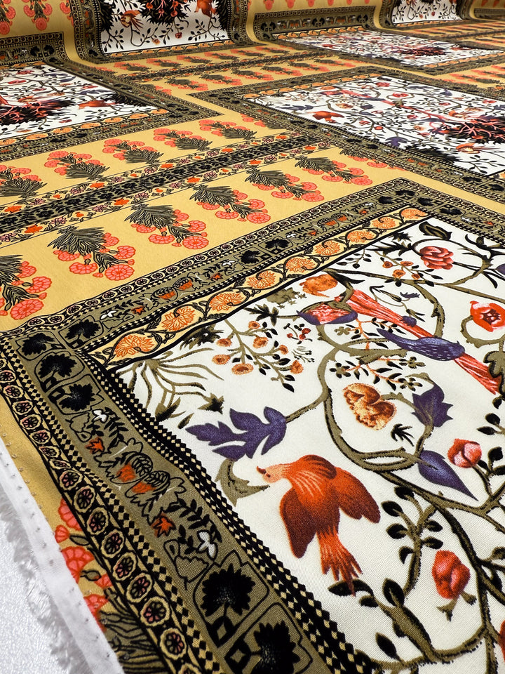 A close-up of Designer Rayon - Antique Tapestry by Super Cheap Fabrics reveals colorful patterns with birds, flowers, and geometric borders in gold, red, black, and cream, displayed in rows on 145cm wide fabric.