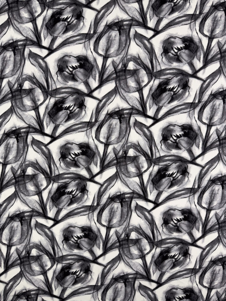 Shadow Petal by Super Cheap Fabrics features a dynamic abstract black and white tulip pattern with visible brushstrokes—ideal for vibrant prints on lightweight rayon fabric. Width: 148cm.