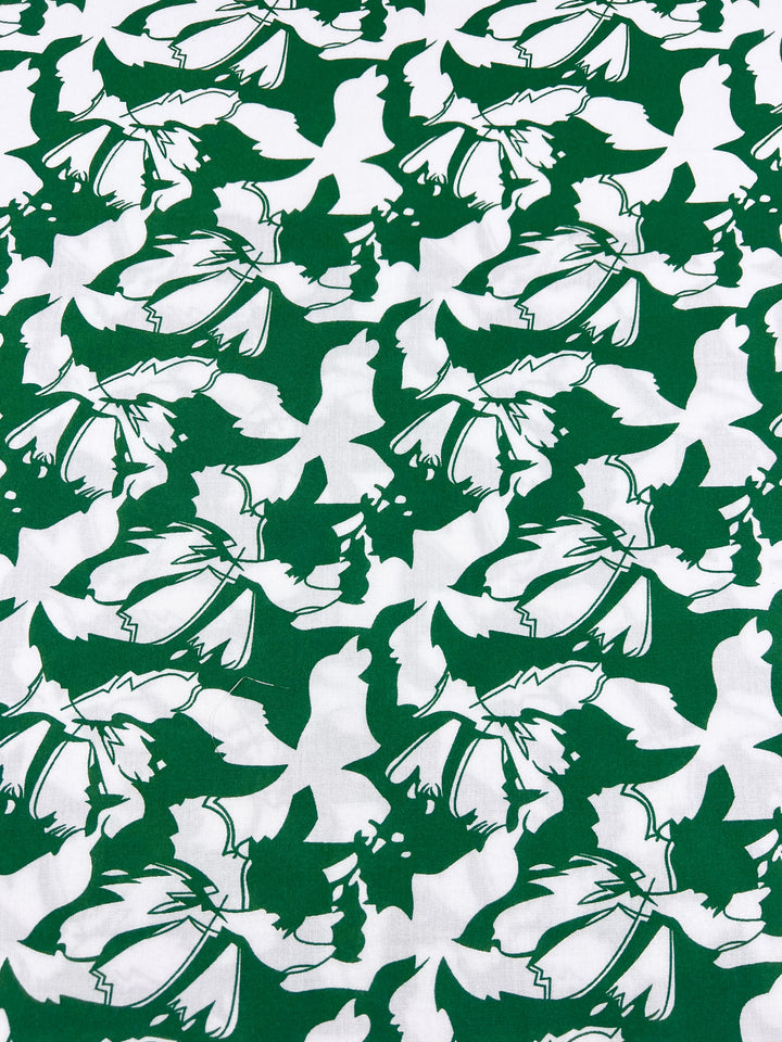 The Designer Rayon - First Tee by Super Cheap Fabrics features a 140cm green and white floral pattern with abstract, overlapping leaf and flower shapes, making it an ideal choice for vibrant, dynamic prints.