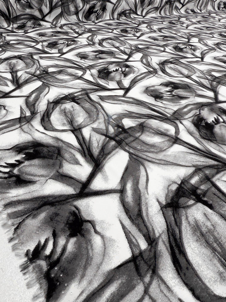 Designer Rayon - Shadow Petal by Super Cheap Fabrics features abstract tulips and leaves in bold black lines and soft shading, creating a dynamic, textured look across 148cm of lightweight fabric.