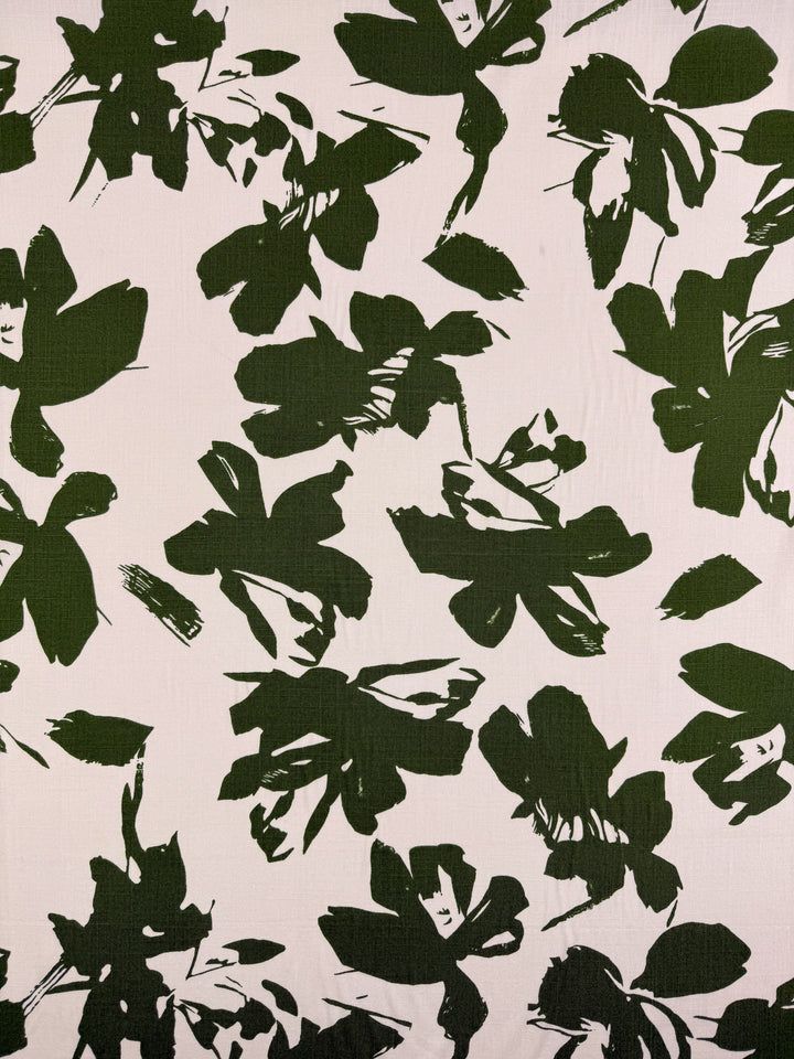 Super Cheap Fabrics' Bamboo Rayon - Olive Bloom - 150cm features a modern abstract green floral design on light beige. Lightweight and beginner-friendly, it’s ideal for fresh creative projects.
