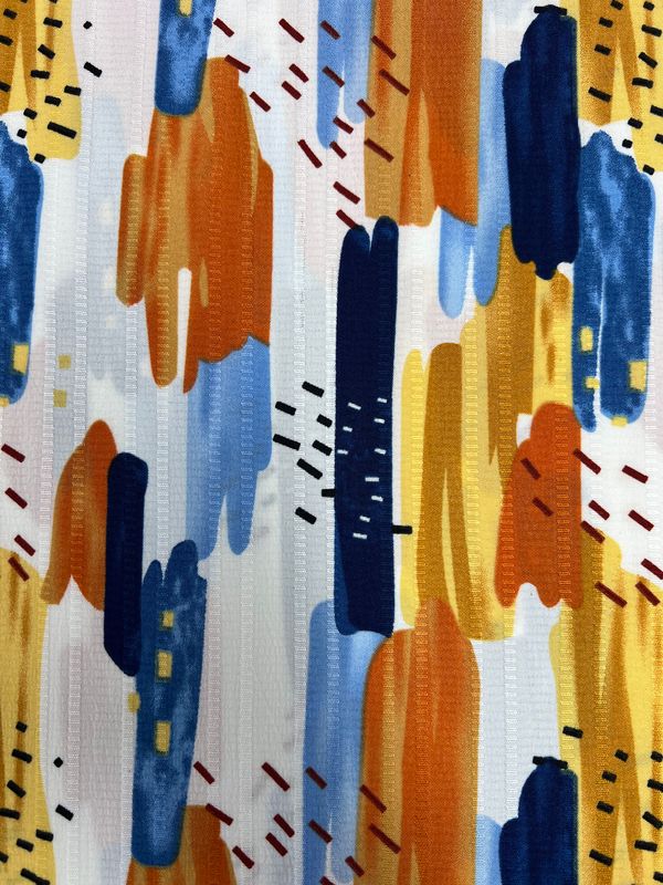 Introducing the Textured Deluxe Print - Stroke & Speck 1.0 - 155cm by Super Cheap Fabrics, featuring an abstract pattern with vertical and horizontal brushstrokes. The design showcases shades of orange, blue, yellow, and black on a white background. The overlapping strokes mimic designer fabrics, creating a dynamic and vibrant visual effect.