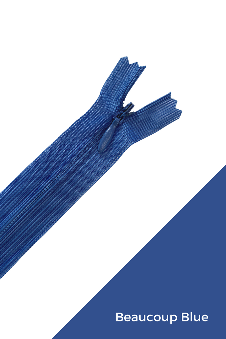 A robust, flexible, and durable blue zipper made from 100% polyester is partially unzipped against a white and blue background, with the text "Beaucoup Blue" in the lower right corner. This "Invisible Zip - 30cm - Blues" is available from Super Cheap Fabrics.